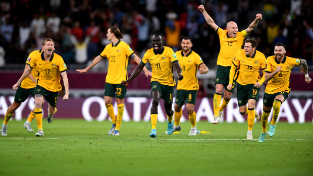 The Socceroos celebrate after defeating Peru in the 2022 FIFA World Cup playoff match at Ahmad Bin Ali Stadium.