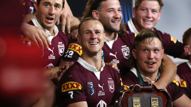 Daly Cherry-Evans of the Maroons celebrates with team mates after winning the series 2-1 after game three of the State of Origin series.