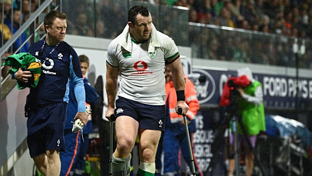 Cian Healy of Ireland wears a moon boot after leaving the field with an injury.