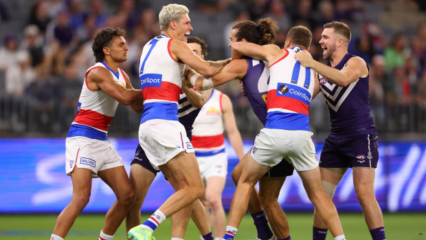 Alex Pearce of the Dockers and Rory Lobb of the Bulldogs wrestle before the first bounce during the round six AFL match between Fremantle Dockers and Western Bulldogs at Optus Stadium, on April 21, 2023, in Perth, Australia. (Photo by Paul Kane/Getty Images)