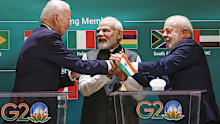 U.S. President Joe Biden, left, Indian Prime Minister Narendra Modi, center, and Brazilian President Luiz Inacio Lula da Silva hold hands as they attend the launch of the Global Biofuels Alliance at the G20 summit in New Delhi, India, Saturday, Sept. 9, 2023. (AP Photo/Evelyn Hockstein, Pool)