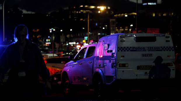 Police set up a cordon line at the scene of a mass shooting at Bondi Beach on December 14, 2025 in Sydney, Australia. 