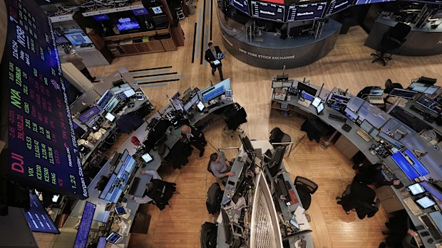 Traders work on the floor of the New York Stock Exchange, Friday, April 11, 2025. (AP Photo/Richard Drew)