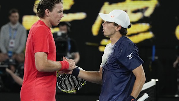 Alex de Minaur, right, of Australia is congratulated by Alex Michelsen.