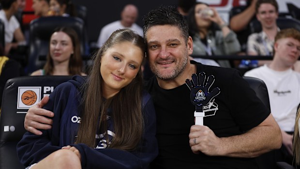 Brendon Fevola and his daughter Lulu pose for a photograph during the round 12 NBL match between Melbourne United and the Perth Wildcats.
