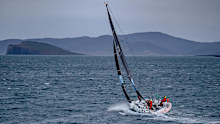 The boat BNC is sailed by Michel Quintin and Yann Rigal pictured near Hobart and the finish line.