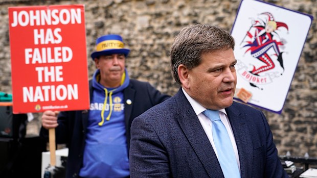 British lawmaker Andrew Bridgen speaks to the media outside the Houses of Parliament, in London. 
