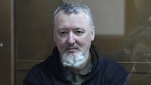 Igor Girkin also know as Igor Strelkov, the former military chief for Russia-backed separatists in eastern Ukraine, sits in a glass cage in a courtroom at the Moscow's City Court in Moscow, Russia, Thursday, Jan. 25, 2024. (AP Photo/Alexander Zemlianichenko)