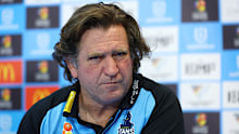 GOLD COAST, AUSTRALIA - JULY 13: Titans coach Des Hasler speaks to the media after the round 19 NRL match between Gold Coast Titans and Brisbane Broncos at Cbus Super Stadium, on July 13, 2025, in Gold Coast, Australia. (Photo by Chris Hyde/Getty Images)
