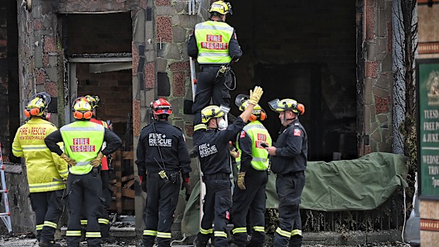 Fire and Rescue and Police investigate the fire which killed at least three people in Newtown, Sydney.