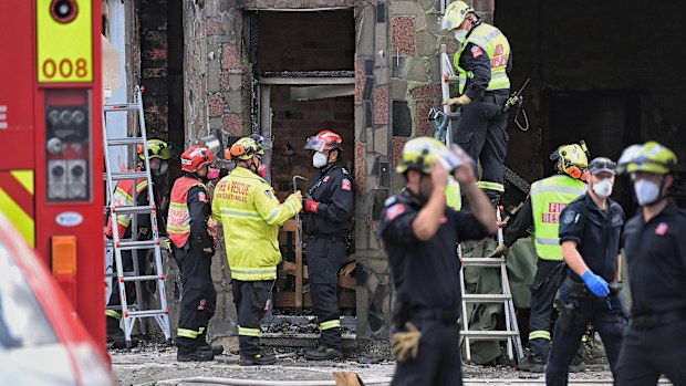 Fire and Rescue and Police investigate the fire which killed at least three people in Newtown, Sydney.