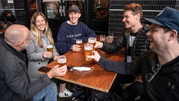 Surry Hills locals enjoy a drink at the Dolphin Hotel as the COVID-19 lockdown ends. 