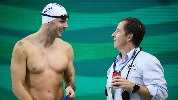 Kyle Chalmers  chats to SASI coach Peter Bishop during the warm-up session of the Australian National Olympic Swimming Trials at SA Aquatic & Leisure Centre on June 17, 2021 in Adelaide, Australia. (Photo by Mark Brake/Getty Images)
