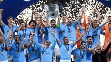 Manchester City lifts the Champions League trophy.