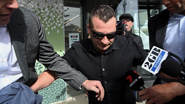 Anthony Koletti (centre) the husband of Melissa Caddick leaves Lidcombe coroners court, NSW.  The coroner described Koletti as an unreliable and unimpressive witness. May 25, 2023. Photo: Kate Geraghty