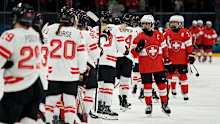 Swiss captain Lara Stalder shakes hands with Team Canada following their Group A preliminary match at Milano Cortina 2026.