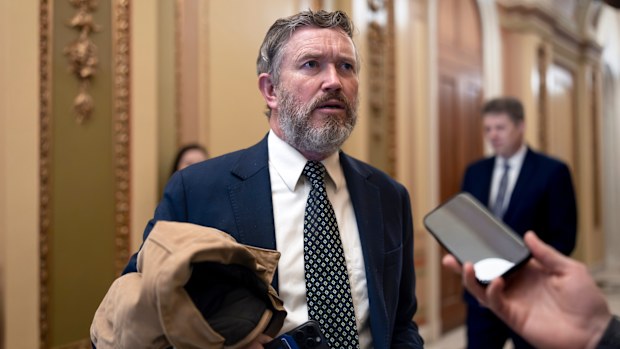 Rep. Thomas Massie, R-Ky., speaks outside the House chamber before the final votes of the week, at the Capitol in Washington, Friday, Dec. 12, 2025. (AP Photo/J. Scott Applewhite)