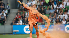 Tom Glover of Melbourne City picks up a flare to remove it from the pitch during the round eight A-League Men's match between Melbourne City and Melbourne Victory at AAMI Park, on December 17, 2022, in Melbourne, Australia. (Photo by Darrian Traynor/Getty Images)