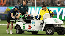 Hilton Cartwright is taken from the field in a neck brace. 