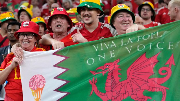 Fans cheer ahead the World Cup, group B soccer match between the United States and Wales, at the Ahmad Bin Ali Stadium in in Doha, Qatar, Monday, Nov. 21, 2022