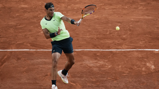 Rafael Nadal returns the ball to Novak Djokovic during their semifinal match of the French Open.