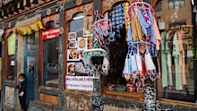 Face masks for use as precaution against coronavirus are displayed for sale at a shop in Thimpu, Bhutan, Monday, April 12, 2021. The tiny Himalayan kingdom wedged between India and China has vaccinated nearly 93% of its adult population since March 27. Overall, the country has vaccinated 62% of its 800,000 people. (AP Photo)