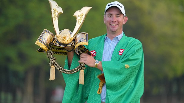Lucas Herbert of Australia poses with the trophy for winning the ISPS Handa Championship.