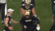 Payton Turner pushes Darren Rizzi after New Orleans' win. 
