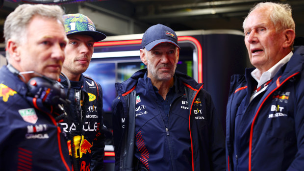 Red Bull Racing team principal Christian Horner, driver Max Verstappen, chief technical officer Adrian Newey and team consultant Helmut Marko look on in the garage.