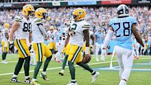 Malik Willis celebrates his touchdown against the Titans.