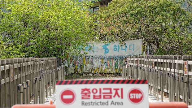 A banner and ribbons wishing reunification of the two Koreas are displayed on the wire fence at the Imjingak Pavilion in Paju, near the border with North Korea. 