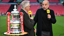 Gary Lineker speaks to Pep Guardiola after Manchester City's victory.