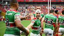 Latrell Mitchell embraces Jye Gray.