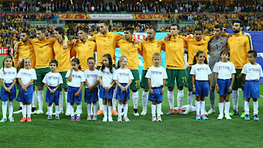 A sell-out crowd paused in anticipation as the Socceroos paused for the national anthem.