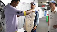 Ravichandran Ashwin is presented with a signed Australian shirt.