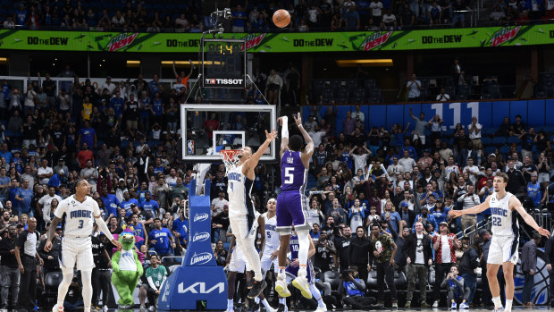 The Kings' De'Aaron Fox hits the game winning three point shot against the Magic.
