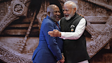 Indian Prime Minister Narendra Modi, right, shares a light moment with African Union Chairman and President of the Union of the Comoros Azali Assoumani upon his arrival at Bharat Mandapam convention centre for the G20 Summit in New Delhi, India, Saturday, Sept. 9, 2023. (AP Photo/Evan Vucci, Pool)
