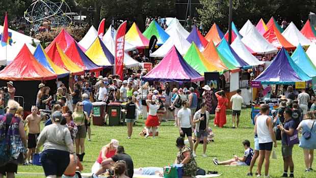 Colourful characters mark crowds at the Gay and Lesbian Mardi Gras Fair Day, Victoria Park.  Sydney. February 20, 2022. Photograph by James Alcock/SMH.
