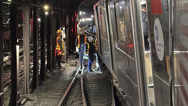This photo provided by NYC Emergency Management shows the derailment of a New York City subway car, Thursday, Jan. 4, 2024. A New York City subway train derailed Thursday after being sideswiped by another train, leaving more than 20 people with minor injuries including some who were brought to hospitals, the New York City Police Department said. (NYC Emergency Management via AP)