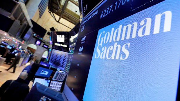 The logo for Goldman Sachs appears above a trading post on the floor of the New York Stock Exchange. (AP Photo/Richard Drew, File)
