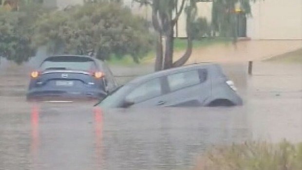 Perth's dry spell has ended in spectacular fashion after a major rain event smashed the city's northern suburbs with up to 100 millimetres falling in under an hour. Cars have ended up underwater after the extreme downpour caused flash flooding and trapped some drivers.