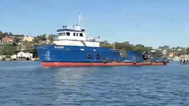 The MV Raider is towed into Sydney Harbour after making a distress call.