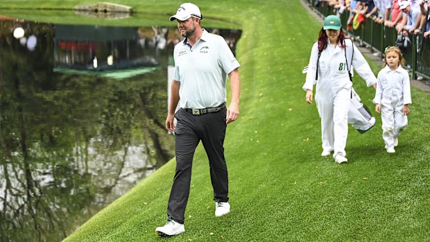 AUGUSTA, GA - APRIL 06:  Marc Leishman of Australia and his wife Audrey Leishman smile with their daughter during the Par Three Contest prior to the Masters at Augusta National Golf Club on April 6, 2022, in Augusta, Georgia. (Photo by Keyur Khamar/PGA TOUR via Getty Images)