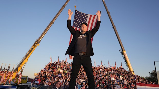 FILE - Tesla and SpaceX CEO Elon Musk walks to the stage to speak at the Butler Farm Show, Oct. 5, 2024, in Butler, Pa. (AP Photo/Alex Brandon, file)