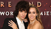 HOLLYWOOD, CALIFORNIA - DECEMBER 01: (L-R) Maxx Morando and Miley Cyrus attend the Global Premiere of 20th Century Studios' "Avatar: Fire And Ash" at Dolby Theatre on December 01, 2025 in Hollywood, California. (Photo by Kevin Winter/WireImage)