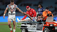 Zac Lomax and Jack Bird embrace after the latter's ankle injury. 