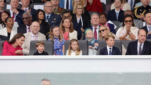(L-R 2nd row) Mike Tindall, Mia Tindall, Victoria Starmer, Lena Tindall, Zara Tindall, (front row) Catherine, Duchess of Cambridge, Prince Louis of Cambridge and Prince William, Duke of Cambridge watch the Platinum Pageant on June 05, 2022 in London, England.