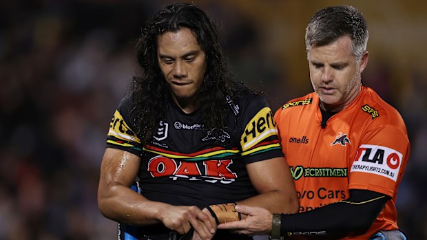 Jerome Luai of the Panthers is assisted from the field after sustaining an injury during the round 26 NRL match between Penrith Panthers and Parramatta Eels at BlueBet Stadium on August 24, 2023 in Penrith, Australia. (Photo by Mark Metcalfe/Getty Images)