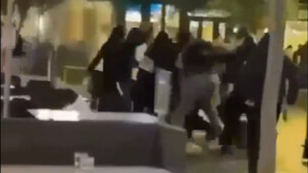 Several masked individuals approahced a table, before attacking a teenager.