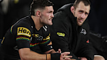 Nathan Cleary and Isaah Yeo warm the Penrith bench.